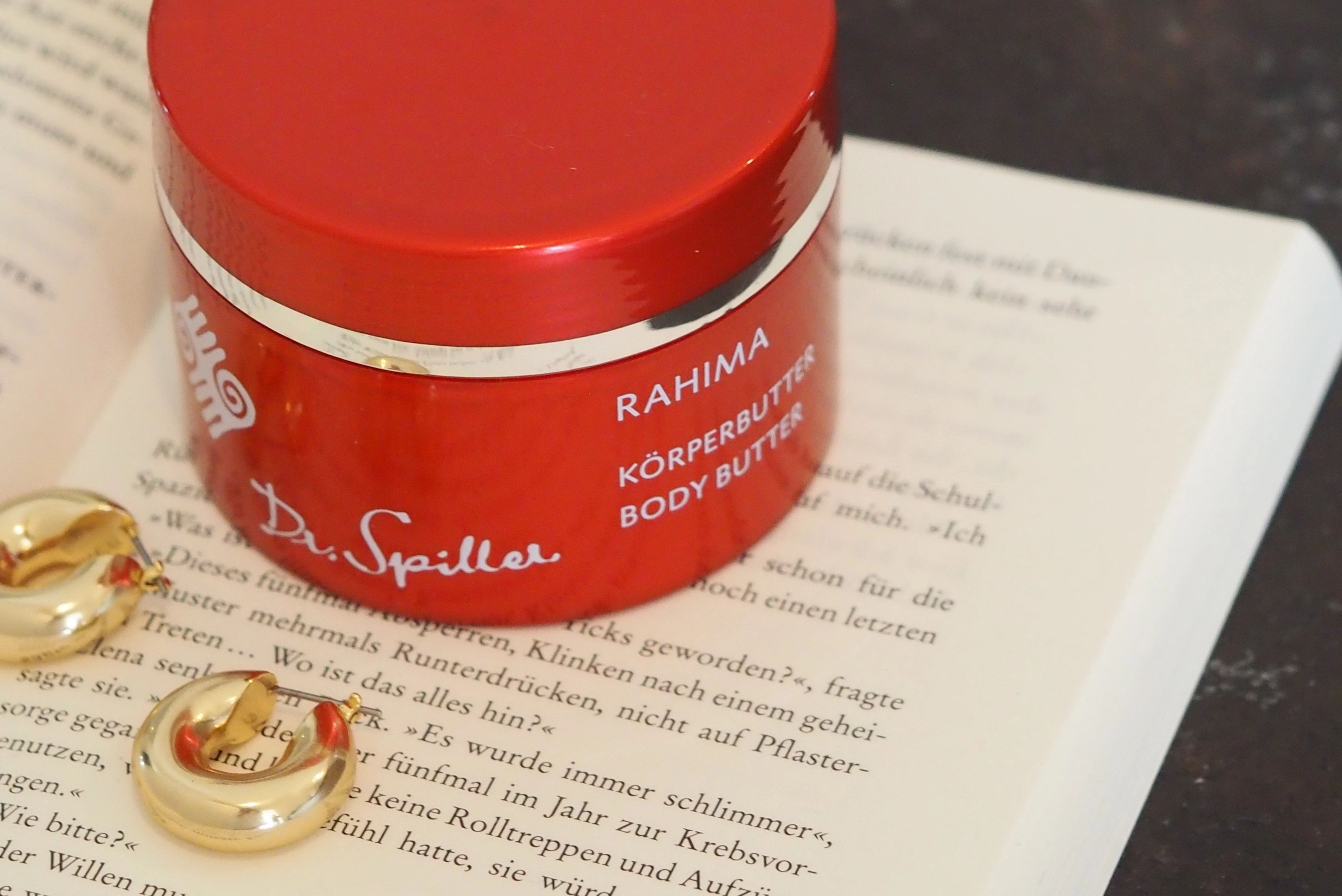 Rahima body butter on book