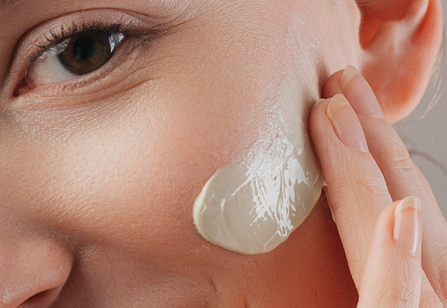 Day cream on the cheek