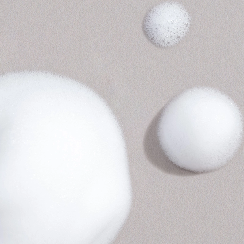 Close-up texture - white, milky cleansing foam