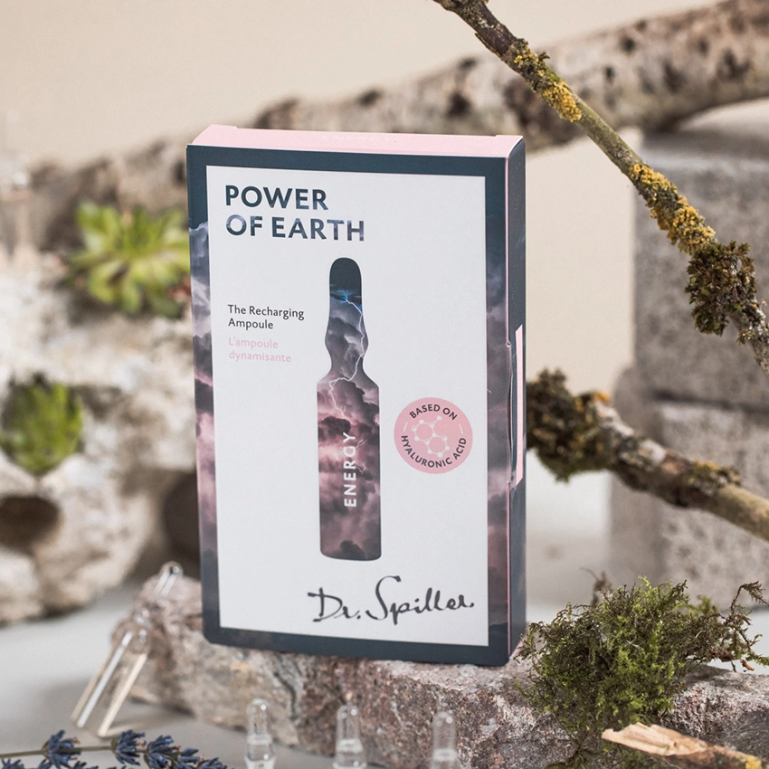 The Recharging Ampoule auf dekorativen Hintergrund