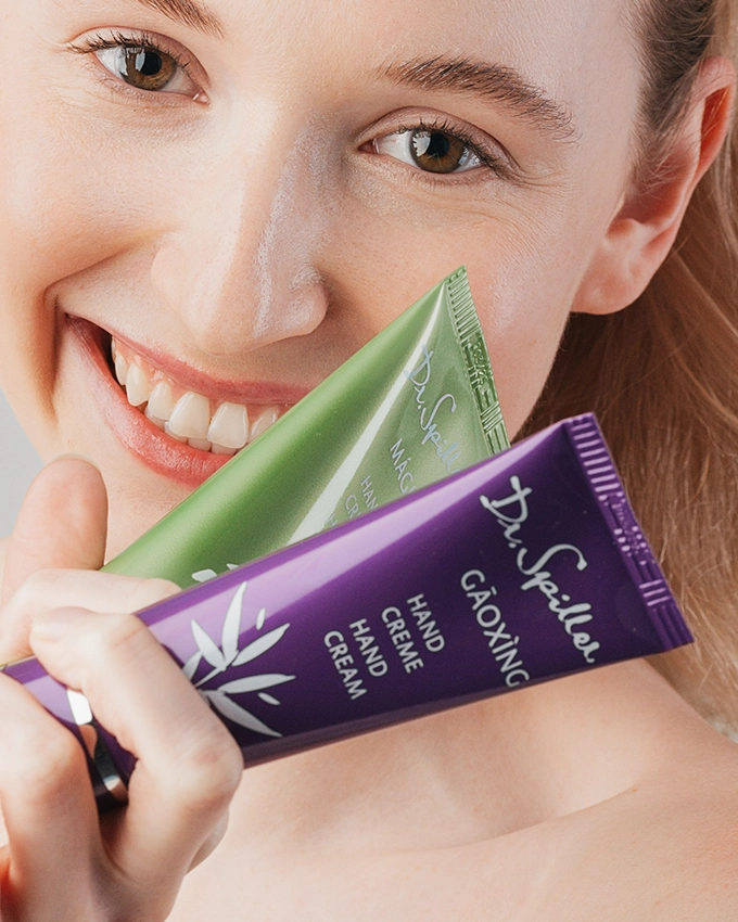 Gaoxing & Magico Handcreme mit lachender Frau