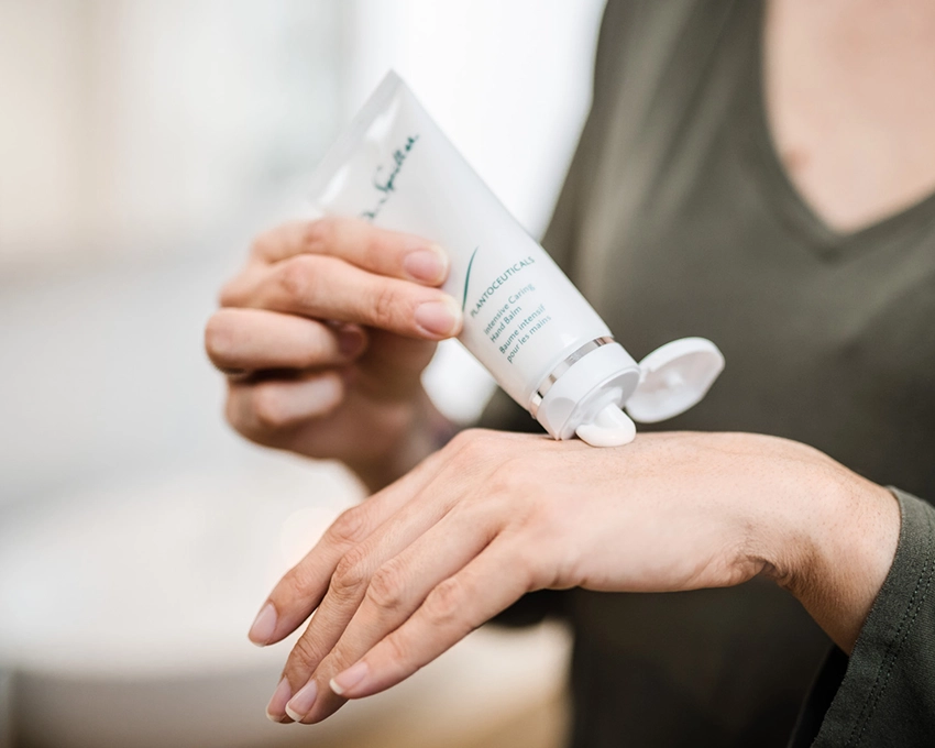 Intense Caring Hand Balm is applied to the back of the hand
