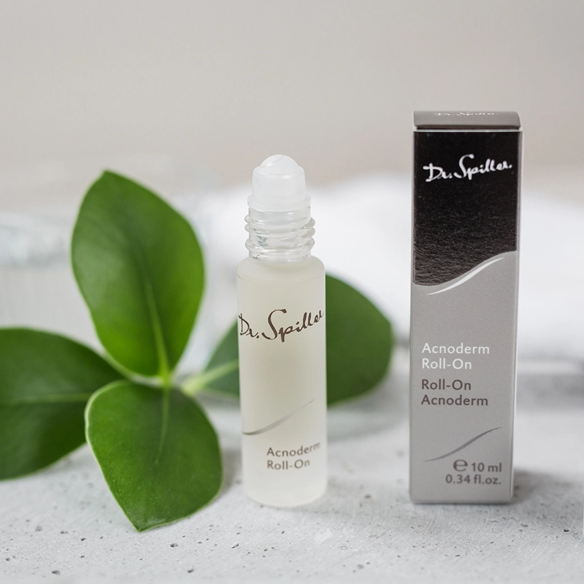 Acnoderm roll-on placed decoratively on
