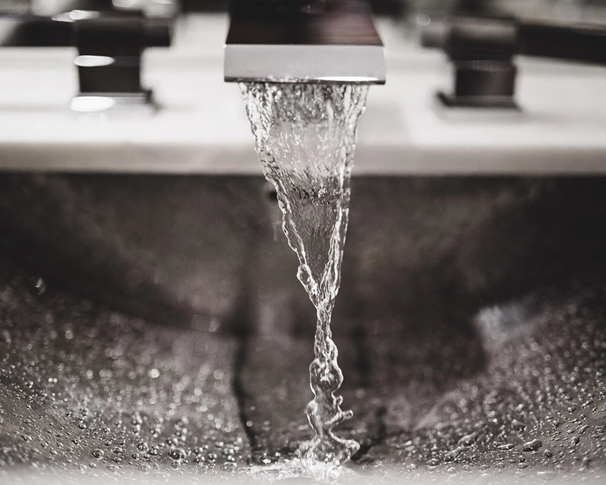 Clear water flows from the tap