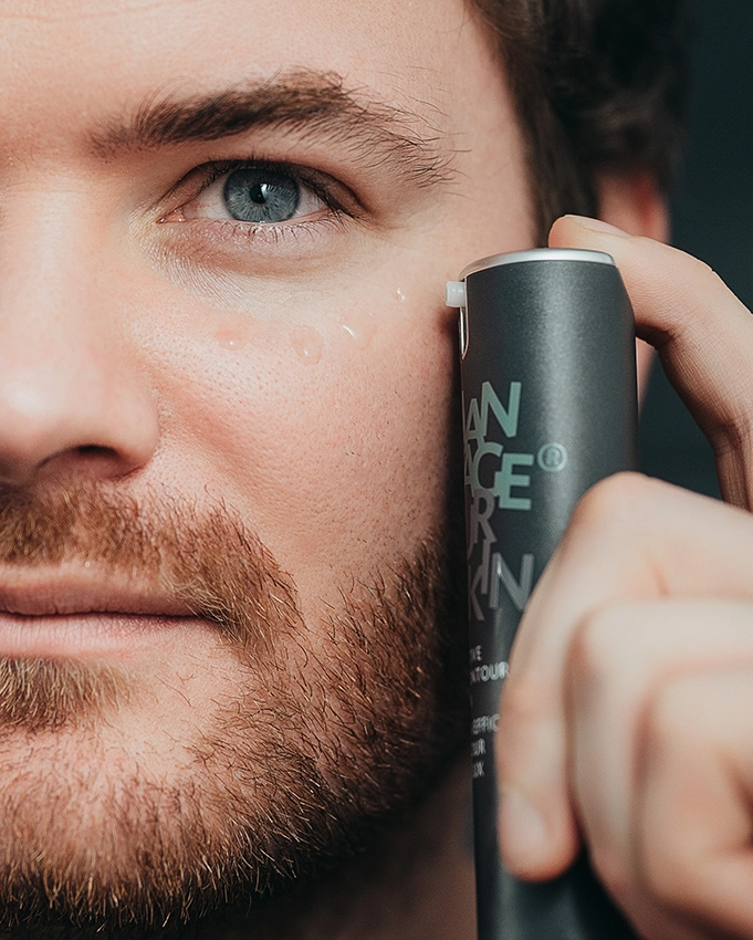 Man applies the Effective Eye Contour Serum