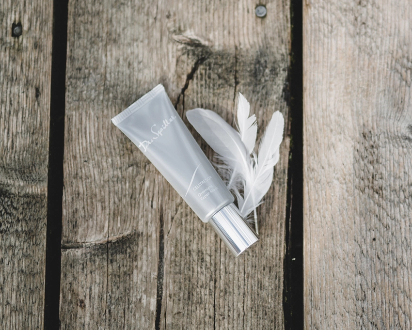 Overnight Repair Mask Tube on a wooden floor